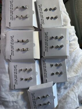 7 silver plated earring sets. NWT. Apple, tree.